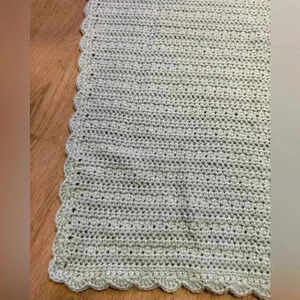 Handmade crocheted baby afghan in light blue with scalloped edge. Never used.